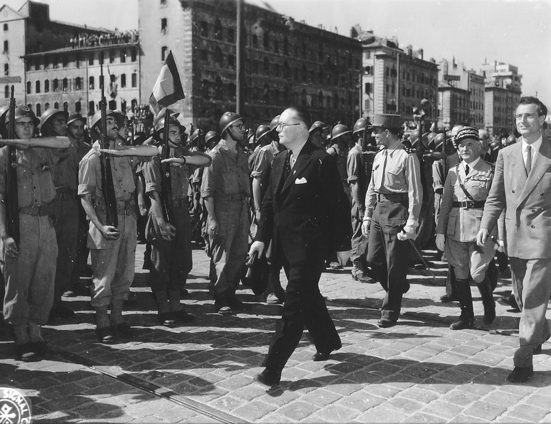 French general Jean de Lattre de Tassigny reviewing troops in the liberated city of Marseille